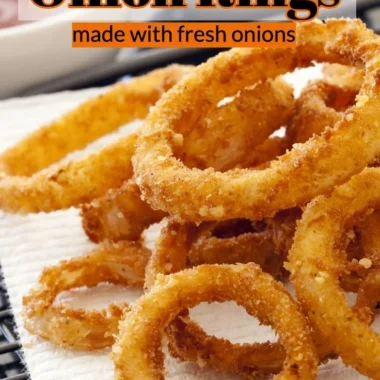 Crispy air fryer onion rings served on a plate with dipping sauce