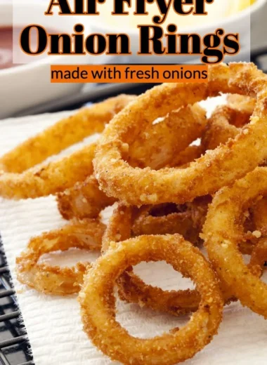Crispy air fryer onion rings served on a plate with dipping sauce