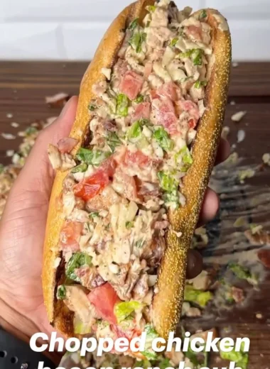 Chopped chicken bacon ranch sub sandwich with toppings on a platter