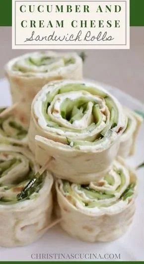 Cucumber and cream cheese sandwich rolls served on a plate