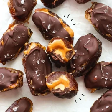 Homemade Date Snickers bars made with dates, nuts, and chocolate