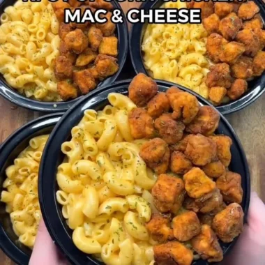 Bowl of KFC Chicken Mac & Cheese topped with crispy chicken strips.