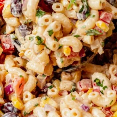 Bowl of colorful Mexican Macaroni Salad with fresh vegetables and spices