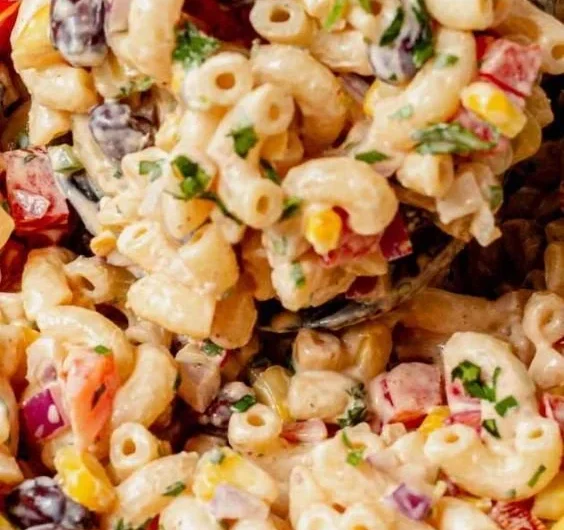 Bowl of colorful Mexican Macaroni Salad with fresh vegetables and spices