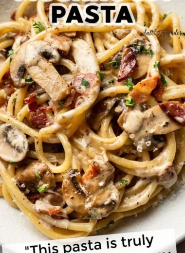 Creamy bacon and mushroom pasta dish garnished with parsley