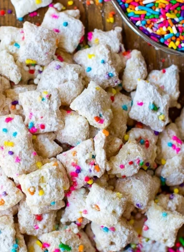 Delicious cake batter puppy chow snack mix with colorful sprinkles.