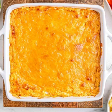 Cheesy creamy buffalo chicken dip served in a bowl with tortilla chips