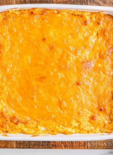 Cheesy creamy buffalo chicken dip served in a bowl with tortilla chips