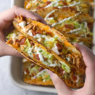 Cheesy oven-crispy chicken bacon ranch tacos on a plate