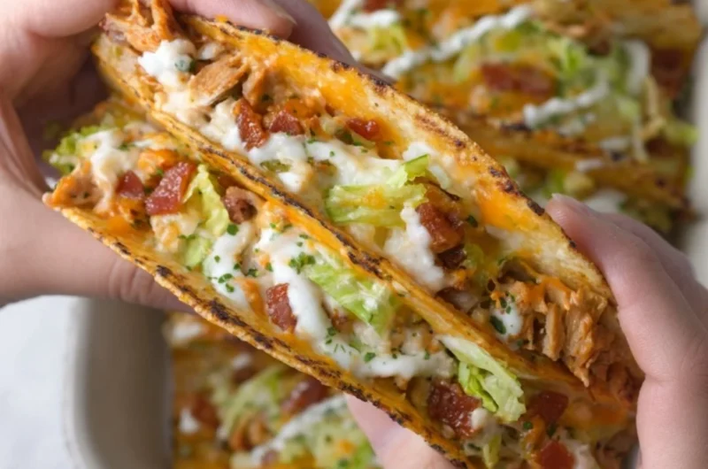 Cheesy oven-crispy chicken bacon ranch tacos on a plate