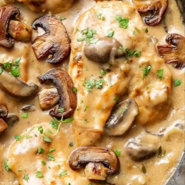 Chicken and mushroom skillet dish garnished and ready to serve.