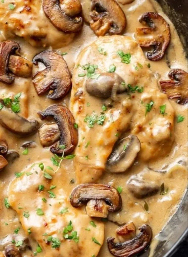 Chicken and mushroom skillet dish garnished and ready to serve.