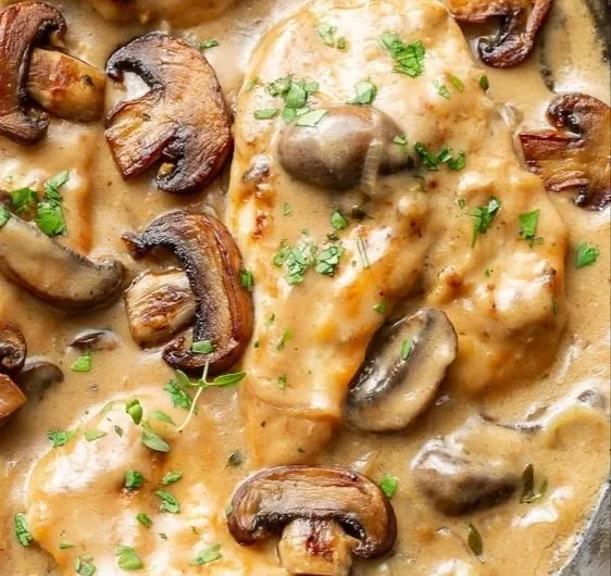 Chicken and mushroom skillet dish garnished and ready to serve.