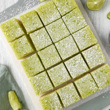 Deliciously baked cozy lime bars with a buttery crust and citrus topping
