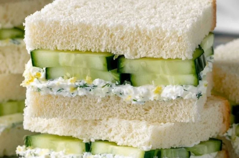 A plate of easy cucumber sandwiches on a floral tablecloth