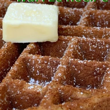 Delicious homemade gingerbread waffles topped with syrup and spices.