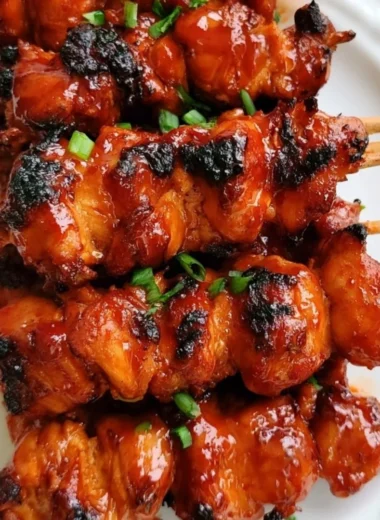 Grilled Korean chicken skewers with vibrant vegetables on a platter