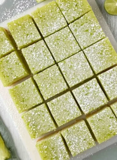 Freshly baked lime bars with a creamy filling and a zesty lime topping