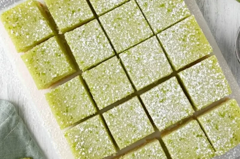 Freshly baked lime bars with a creamy filling and a zesty lime topping