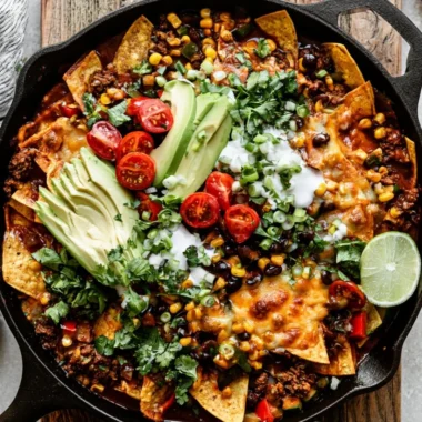 One pan enchilada skillet with vibrant vegetables and cheesy toppings