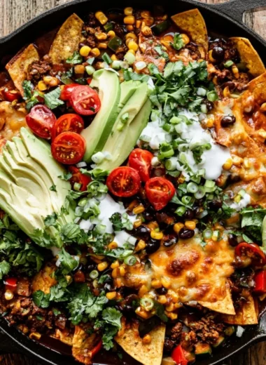 One pan enchilada skillet with vibrant vegetables and cheesy toppings