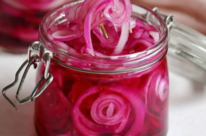 Jar of quick pickled red onions for tasty meal enhancements