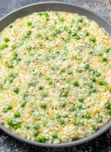 A vibrant serving of Rice and Peas, showcasing its rich flavors and colors.