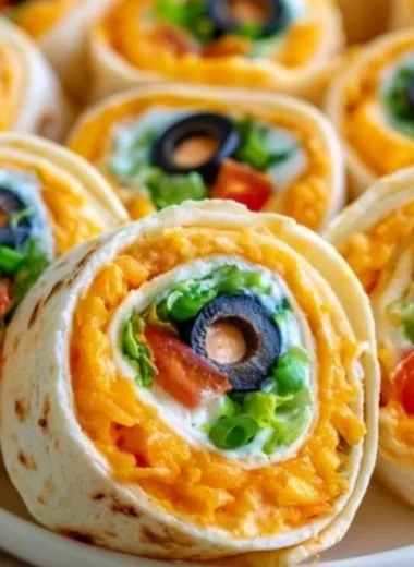 Taco Cream Cheese Pinwheels wrapped and sliced on a platter, perfect for appetizers