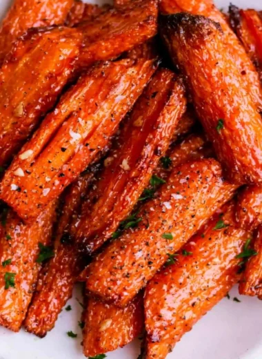 Air fryer carrots served with honey garlic butter in a bowl