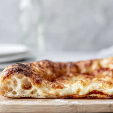 Delicious artisan pizza topped with fresh ingredients and baked to perfection.