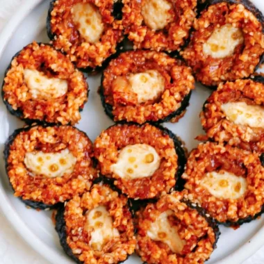 Delicious Cheese Kimchi Kimbap featuring vibrant kimchi and melted cheese roll.