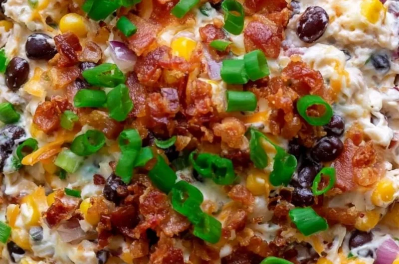 Delicious Cowboy Corn Dip served in a bowl with tortilla chips.