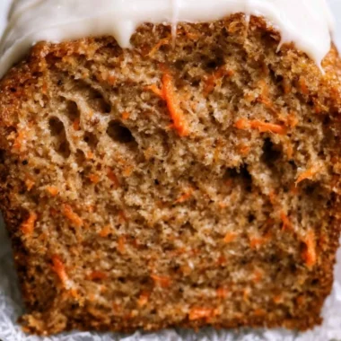 Delicious cozy carrot cake loaf topped with cream cheese frosting
