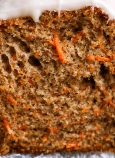 Delicious cozy carrot cake loaf topped with cream cheese frosting