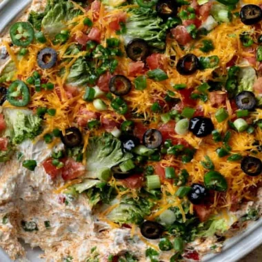 Cozy cottage cheese taco dip served in a bowl with tortilla chips