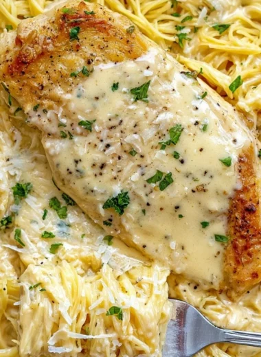 Cozy Crock Pot Angel Chicken served on a plate with herbs