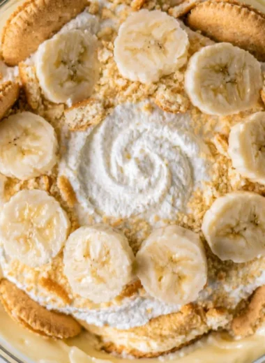 Cozy homemade banana pudding topped with fresh bananas and whipped cream