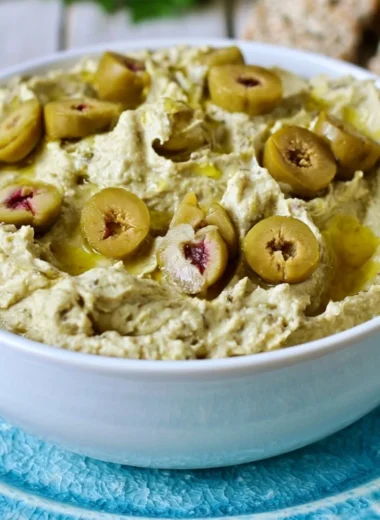 Cozy Olive Hummus dip served with fresh vegetables