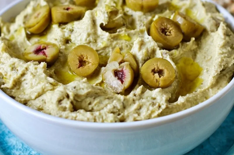 Cozy Olive Hummus dip served with fresh vegetables