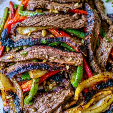 Delicious and cozy steak fajitas served with vibrant peppers and onions.
