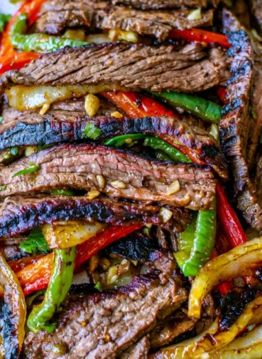 Delicious and cozy steak fajitas served with vibrant peppers and onions.