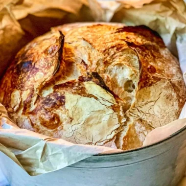 Homemade easy Dutch Oven Bread freshly baked with a golden crust