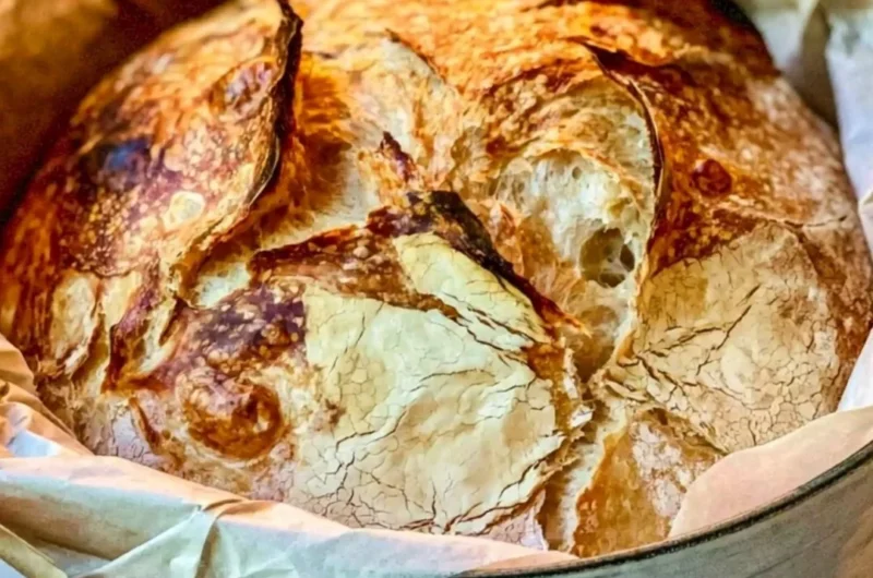 Homemade easy Dutch Oven Bread freshly baked with a golden crust