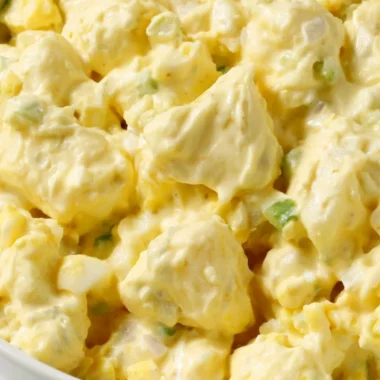 Delicious homemade potato salad with fresh herbs and dressing