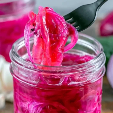 Jar of quick pickled red onions ready to enhance any meal