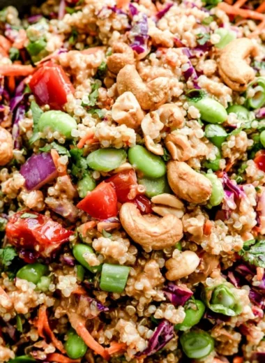 Colorful Thai quinoa salad with fresh vegetables, herbs, and a zesty dressing