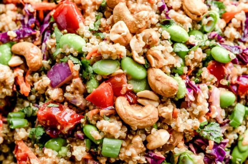 Colorful Thai quinoa salad with fresh vegetables, herbs, and a zesty dressing