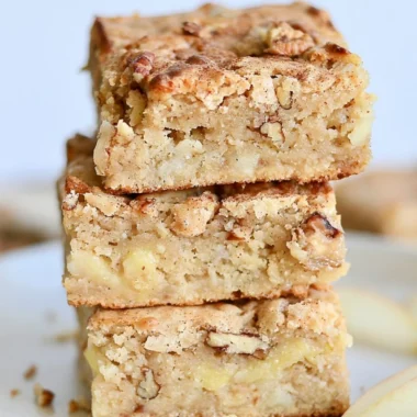 Delicious homemade cozy apple brownies topped with cinnamon and walnuts