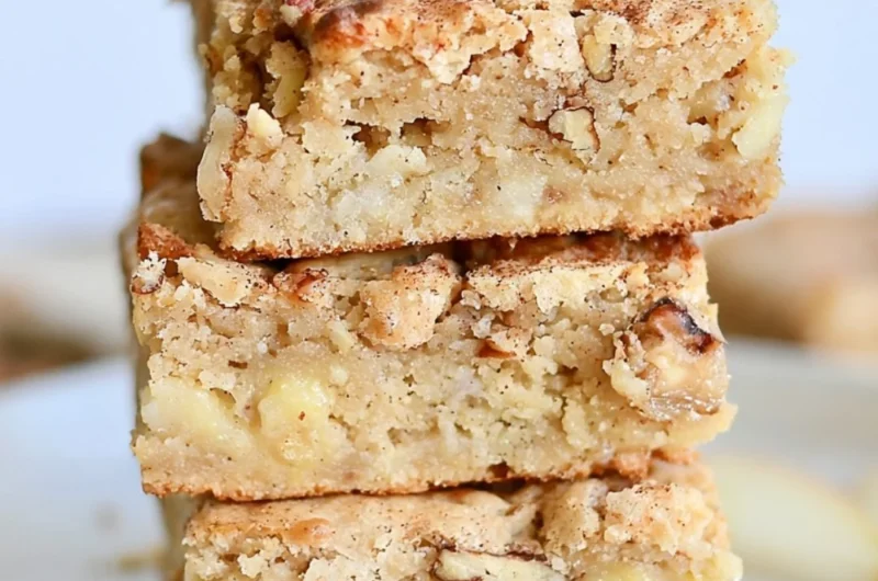 Delicious homemade cozy apple brownies topped with cinnamon and walnuts