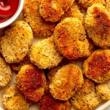 Cozy healthy chicken nuggets served with a side of vegetables